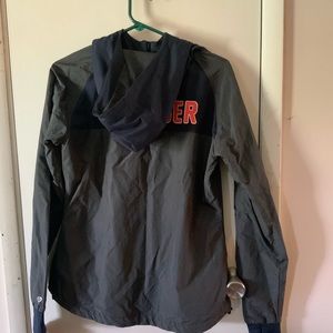 Women’s OKC Thunder wind breaker with hood. Has thumb slits in wrists by design.